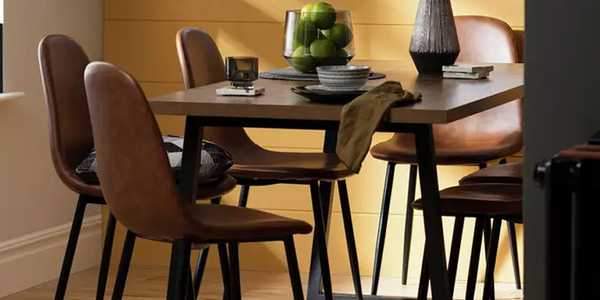 Habitat Nomad oak dining table and 6 tan chairs.